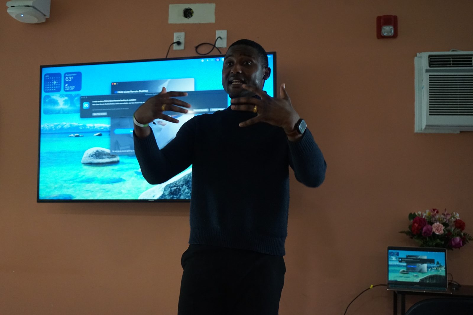 Maina Ibn Mohammed presenting a career tool interface on screen to a session