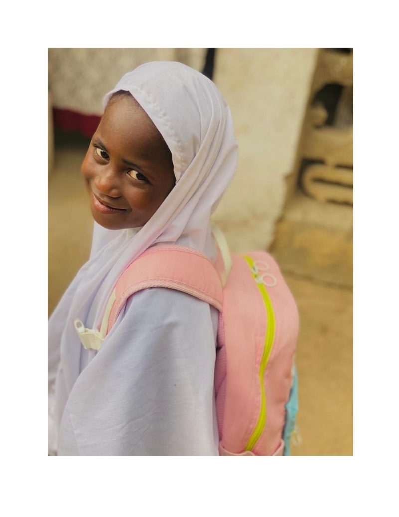 Fatima Mohammed looking over her shoulder with a quiet confident smile