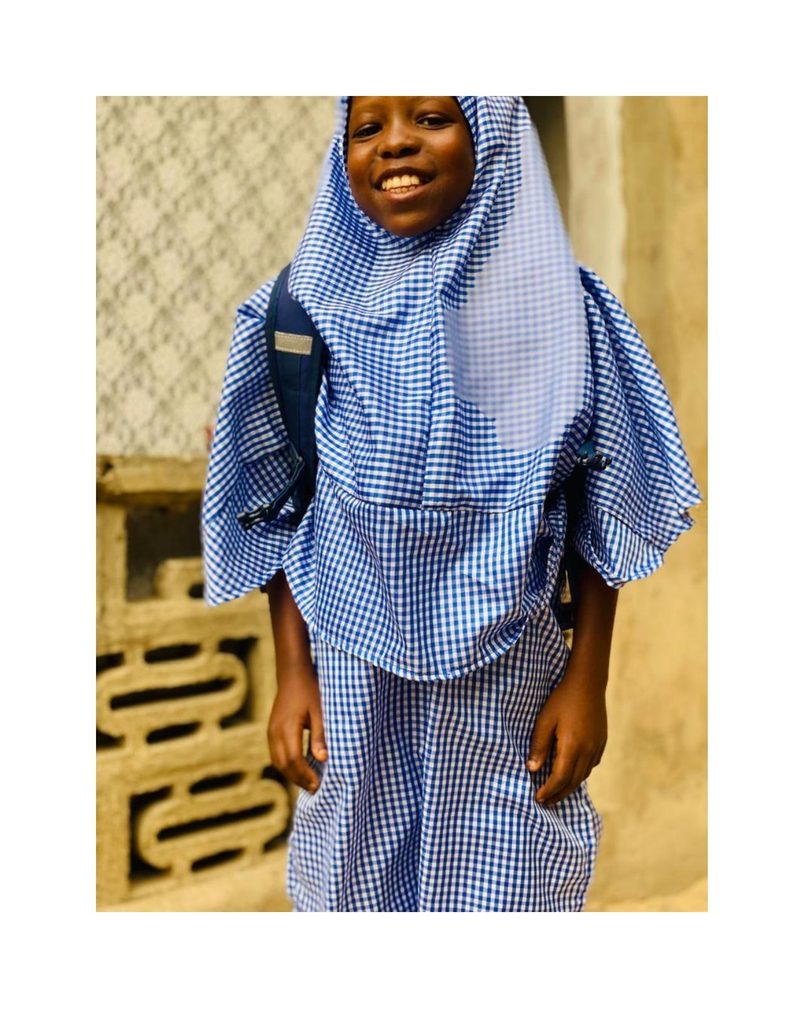 Bilkisu Umaru smiling in her school uniform